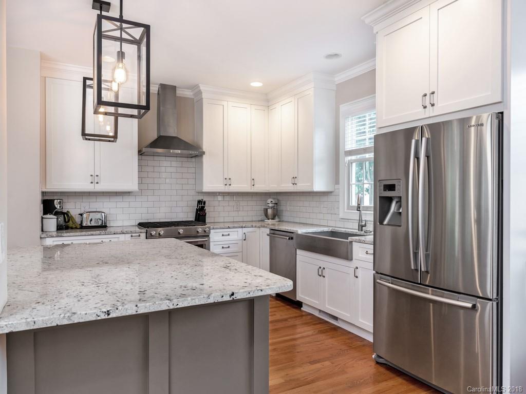 1148 Market Street Fort Mill, SC 29708 - Photo 9 of 25 a kitchen with stainless steel appliances granite countertop a refrigerator a sink and white cabinets
