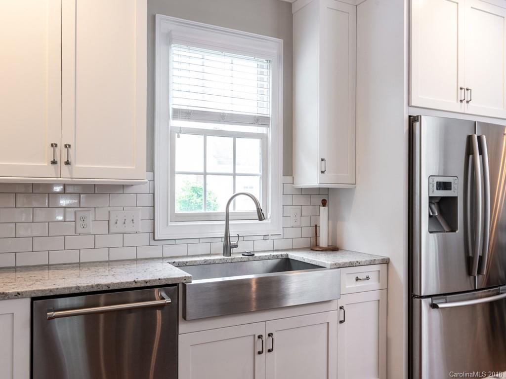 1148 Market Street Fort Mill, SC 29708 - Photo 10 of 25 a kitchen with stainless steel appliances granite countertop a sink stove and refrigerator