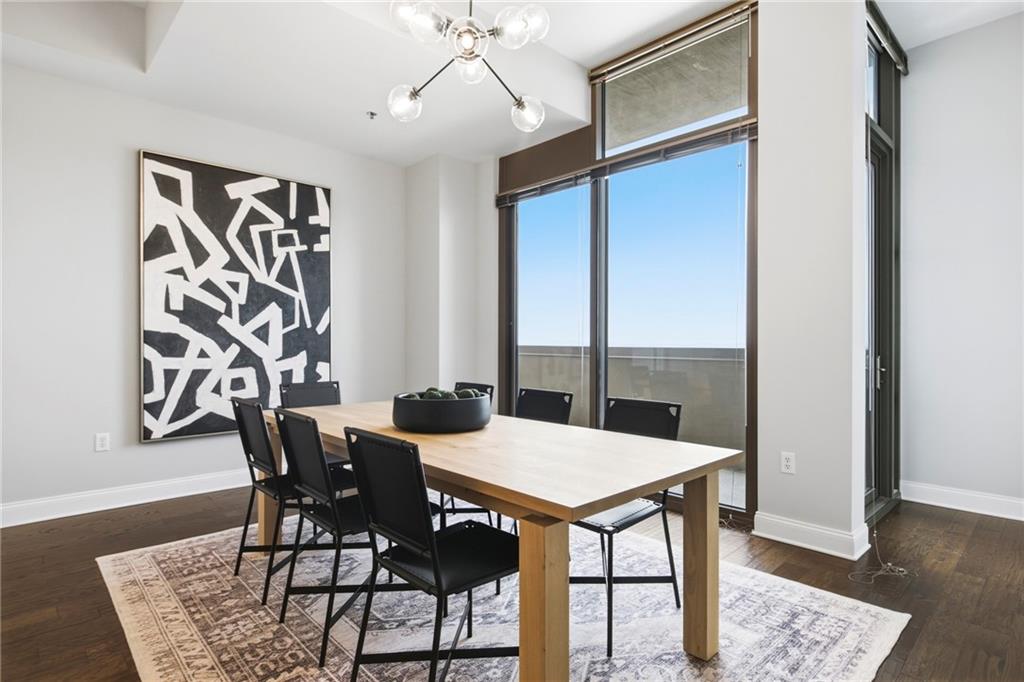 270 17th Street Northwest, Unit 4306 Atlanta, GA 30363 - Photo 14 of 37 a view of a dining room with furniture and wooden floor