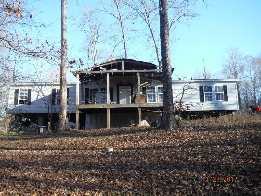 599 Lucas Road Dickson, TN 37055 - Photo 1 of 12 a view of a house with backyard and sitting area