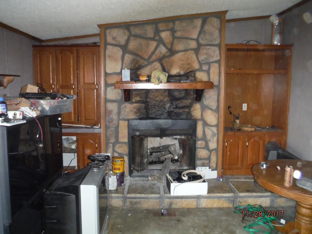 599 Lucas Road Dickson, TN 37055 - Photo 7 of 12 a living room with furniture and a fireplace