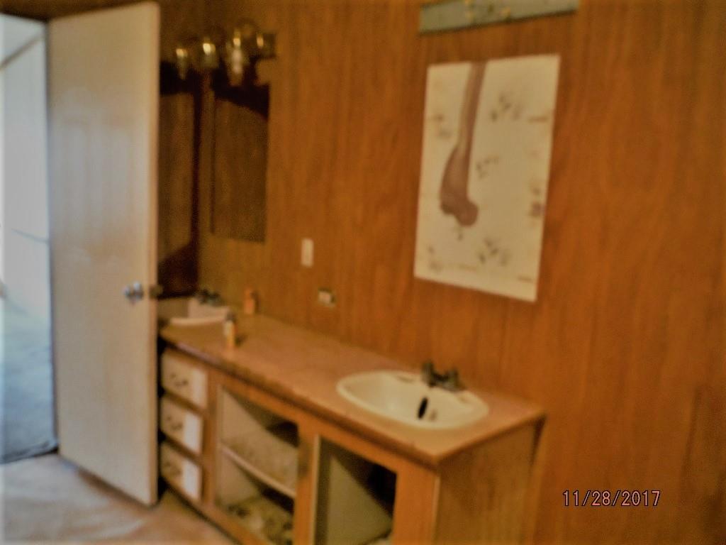 599 Lucas Road Dickson, TN 37055 - Photo 9 of 12 a bathroom with a sink and a mirror