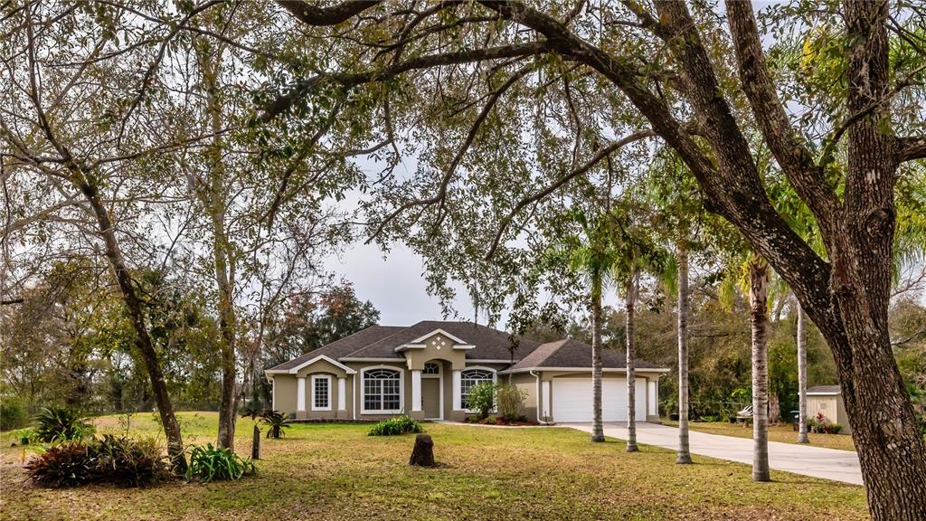 18830 Starry Street Orlando, FL 32833 - Photo 1 of 1 a front view of a house with a garden