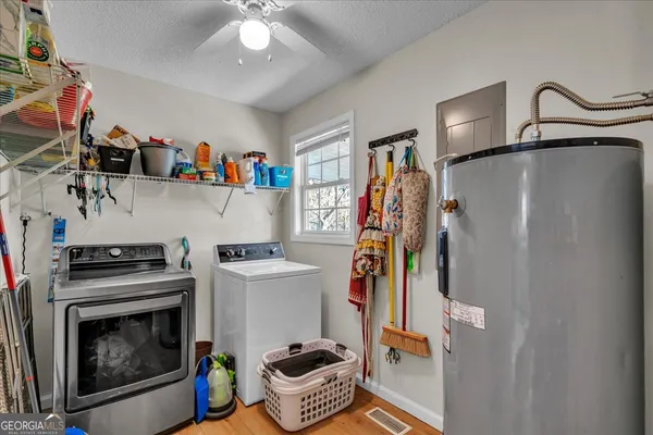 a kitchen with a refrigerator and a stove