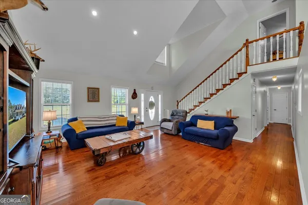 a living room with furniture and a flat screen tv
