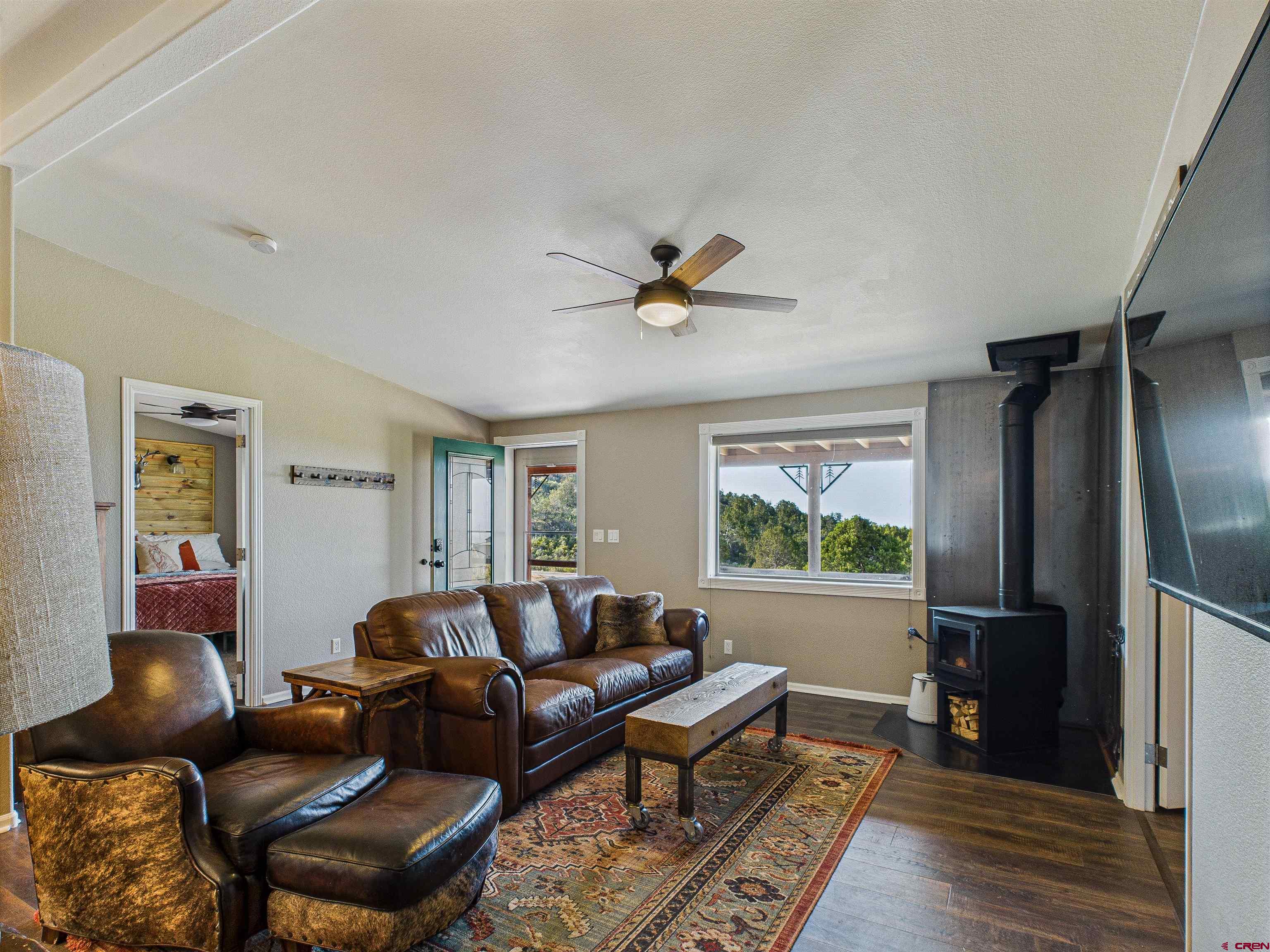 21578 Highway 65 Cedaredge, CO 81413 - Photo 25 of 45 a living room with furniture and a window