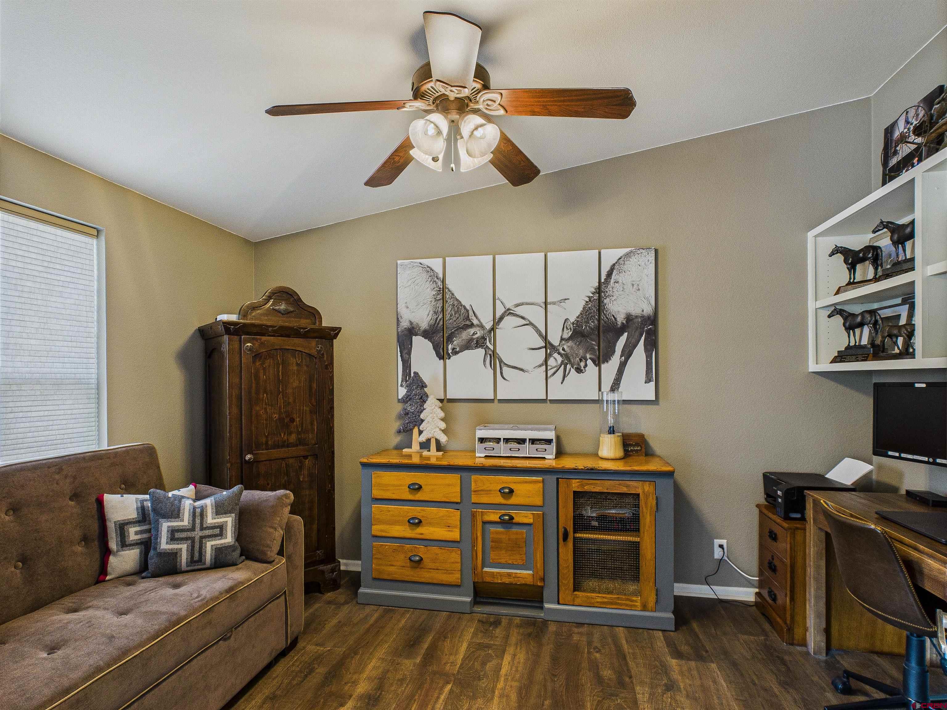 21578 Highway 65 Cedaredge, CO 81413 - Photo 31 of 45 a bedroom with furniture and wooden floor