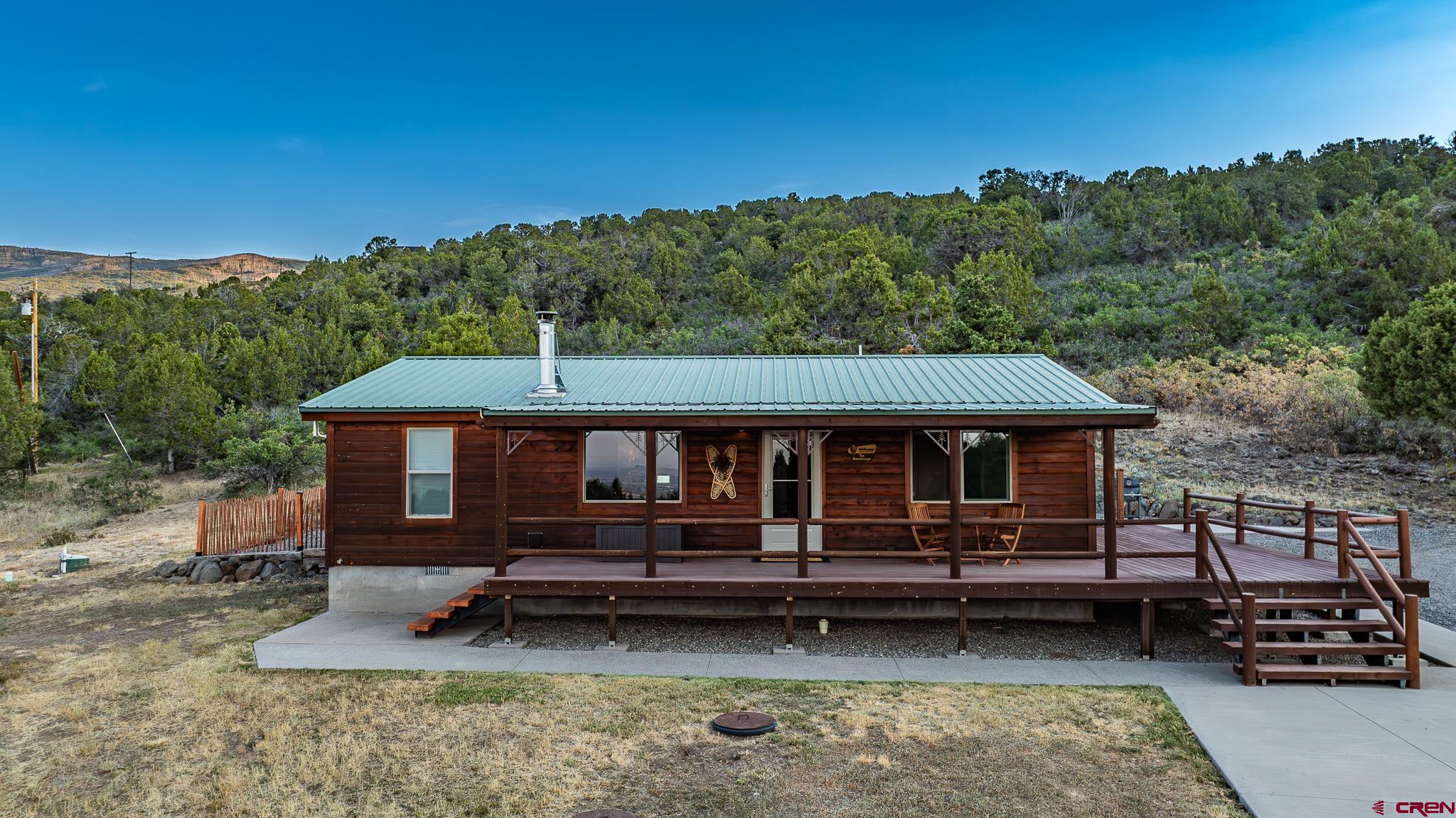 21578 Highway 65 Cedaredge, CO 81413 - Photo 4 of 45 a view of a house with a yard