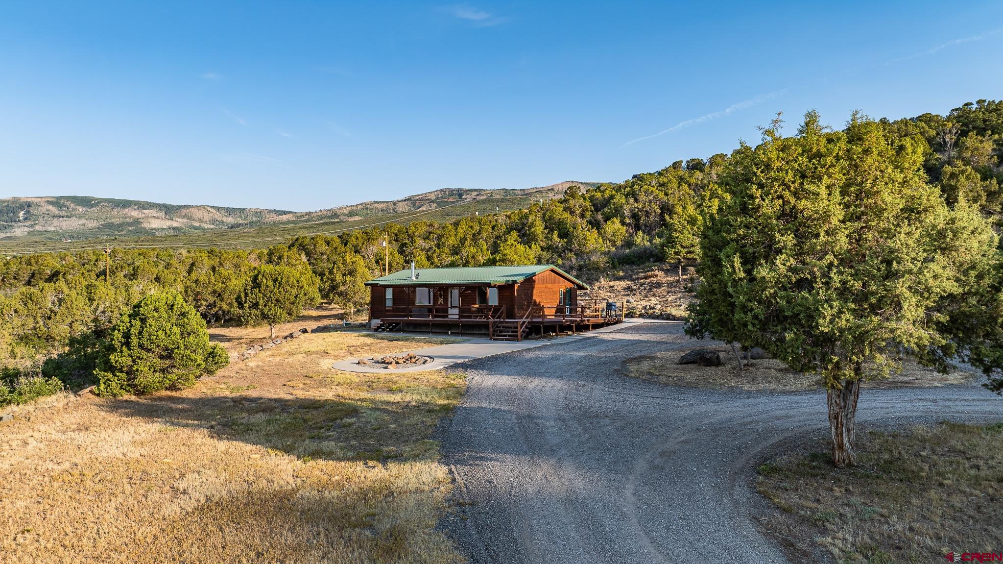 21578 Highway 65 Cedaredge, CO 81413 - Photo 9 of 45 a view of a city with tall trees