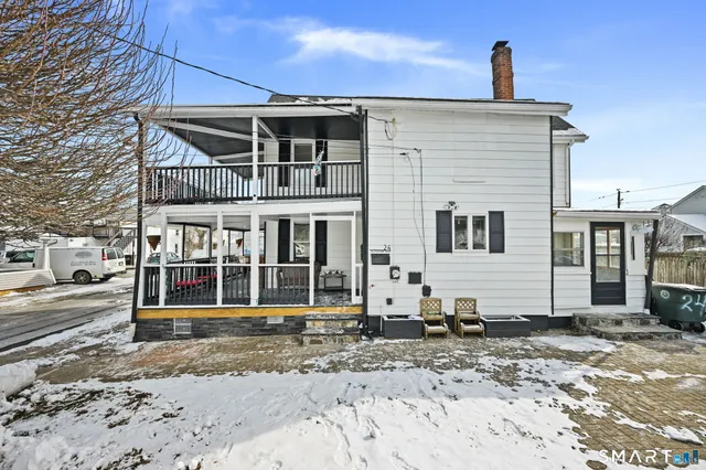 a living room with furniture and a gate