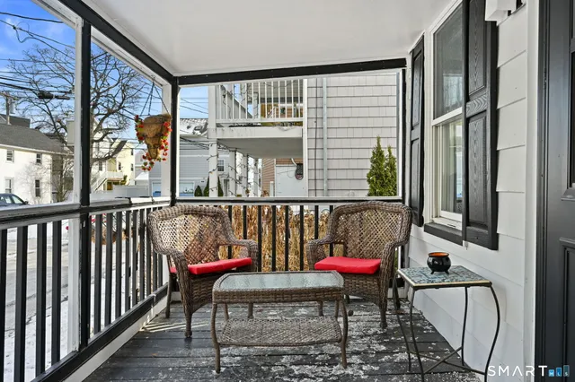 a view of a balcony with furniture