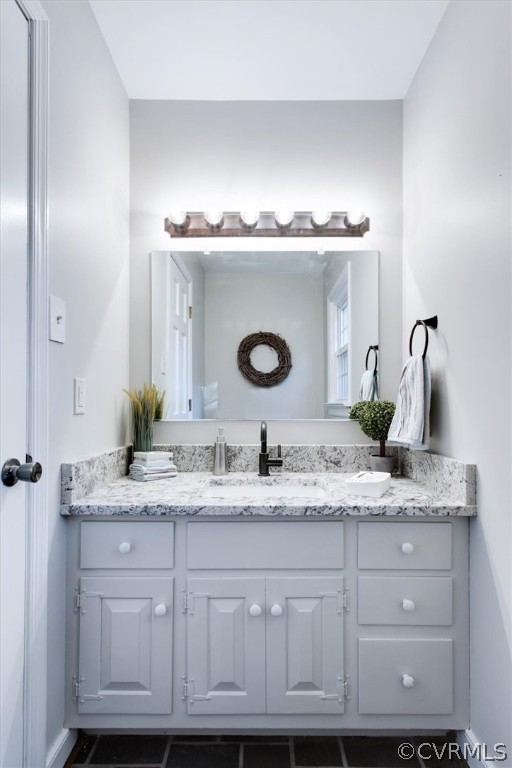 3670 Hemlock Road Chester, VA 23831 - Photo 15 of 49 a bathroom with a granite countertop sink and a mirror