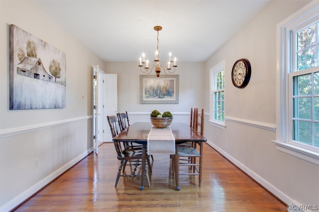 3670 Hemlock Road Chester, VA 23831 - Photo 16 of 49 a view of a dining room with furniture wooden floor and a chandelier