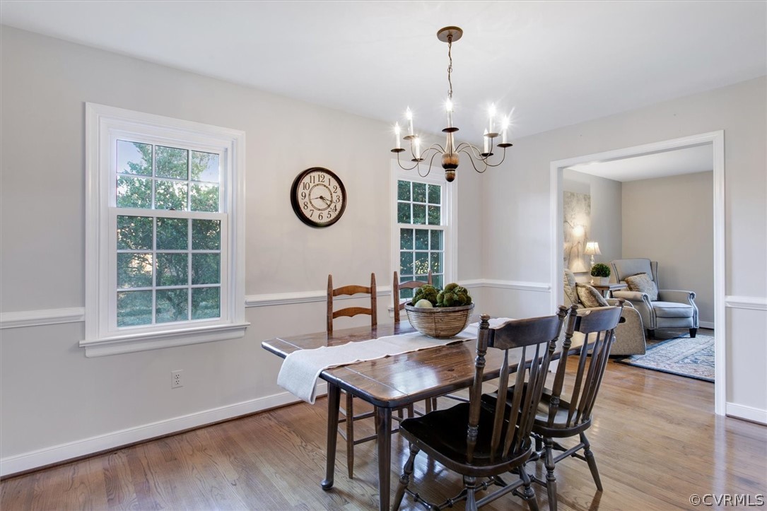 3670 Hemlock Road Chester, VA 23831 - Photo 18 of 49 a view of a dining room with furniture window and wooden floor