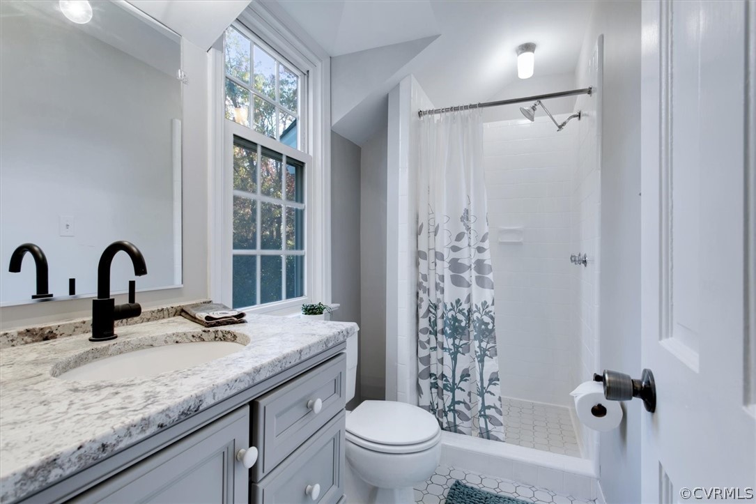 3670 Hemlock Road Chester, VA 23831 - Photo 28 of 49 a bathroom with a granite countertop sink toilet and shower