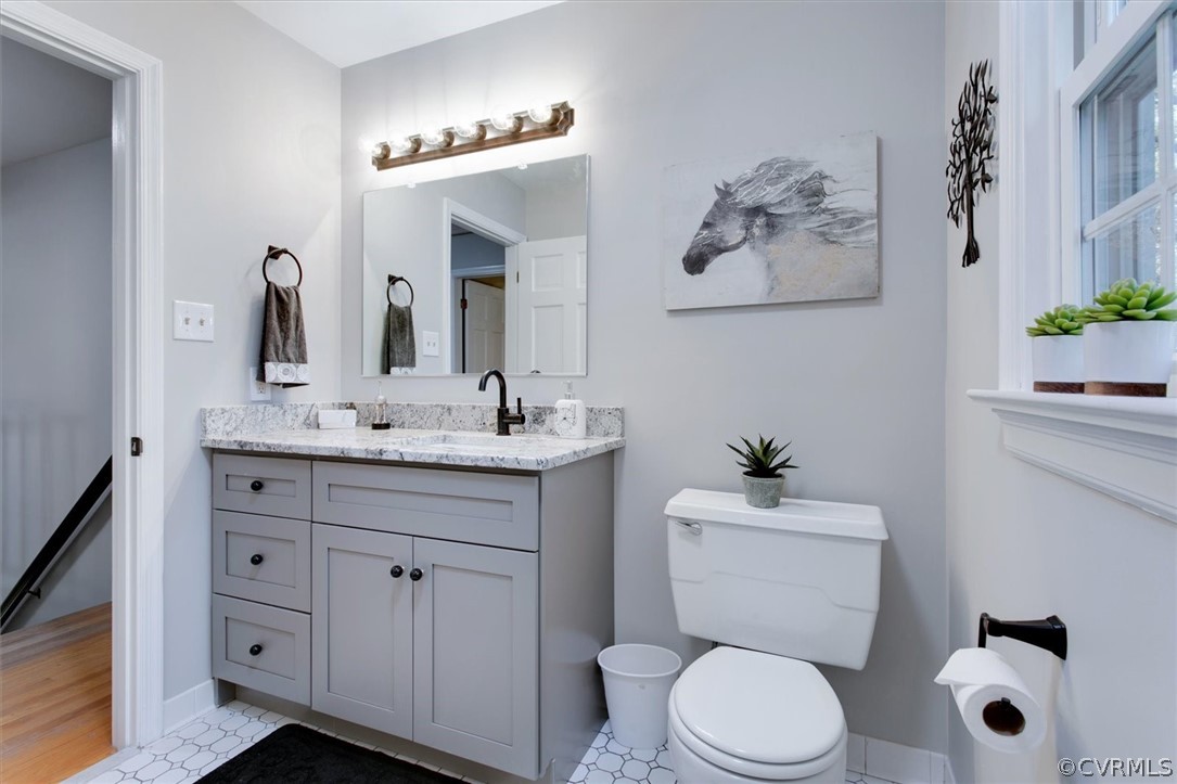 3670 Hemlock Road Chester, VA 23831 - Photo 34 of 49 a bathroom with a toilet sink and mirror