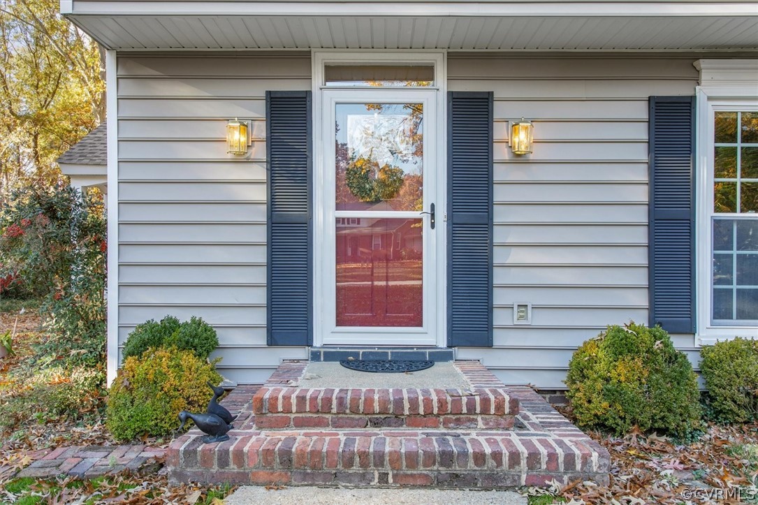 3670 Hemlock Road Chester, VA 23831 - Photo 42 of 49 a front view of a house with garden