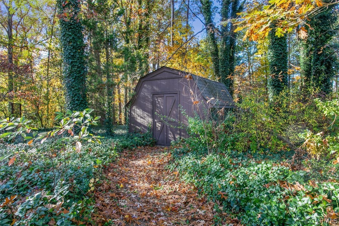 3670 Hemlock Road Chester, VA 23831 - Photo 49 of 49 a view of a yard with plants and large trees