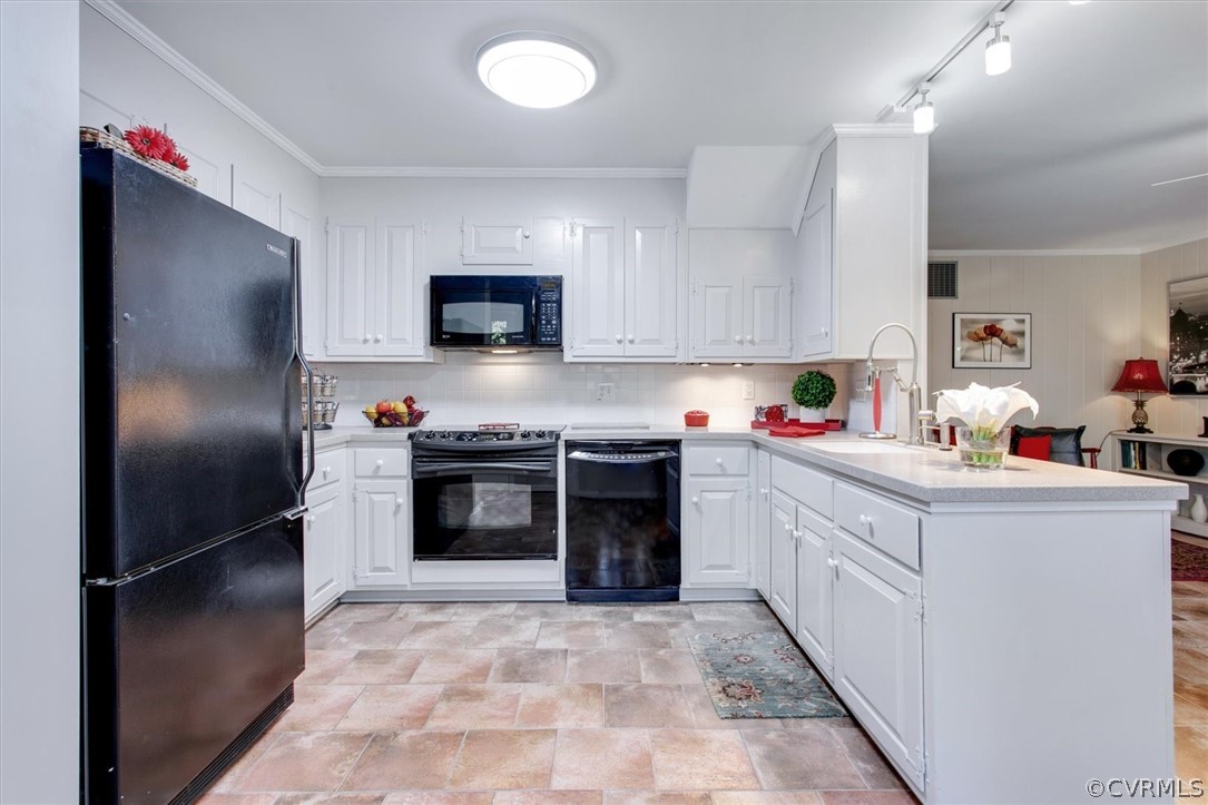 3670 Hemlock Road Chester, VA 23831 - Photo 6 of 49 a kitchen with stainless steel appliances a stove a sink and a refrigerator