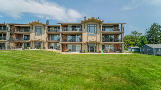 a front view of a building with a garden