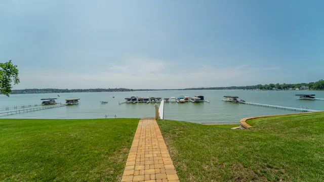 a view of a swimming pool and a yard