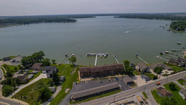 an aerial view of a house with a lake view