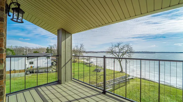 a kitchen with stainless steel appliances granite countertop a sink a stove and cabinets