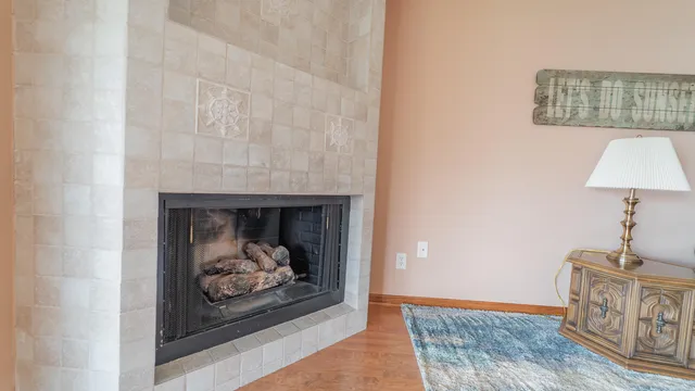 a workspace with furniture and a fireplace