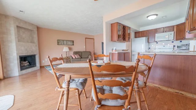a dining room with furniture and wooden floor