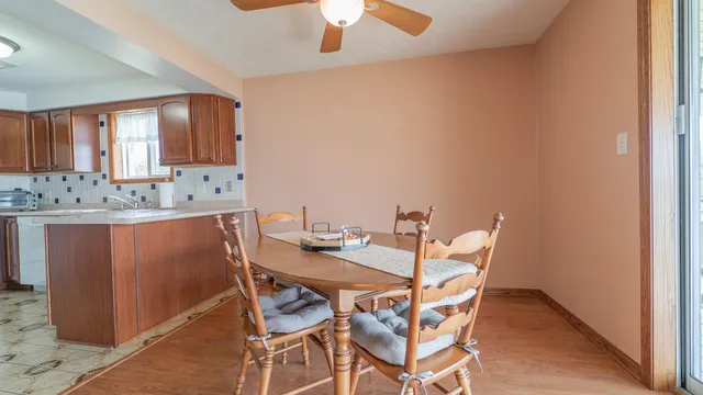 a dining room with a table and chairs