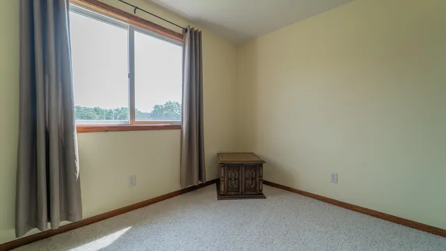 a room with a bench and dresser