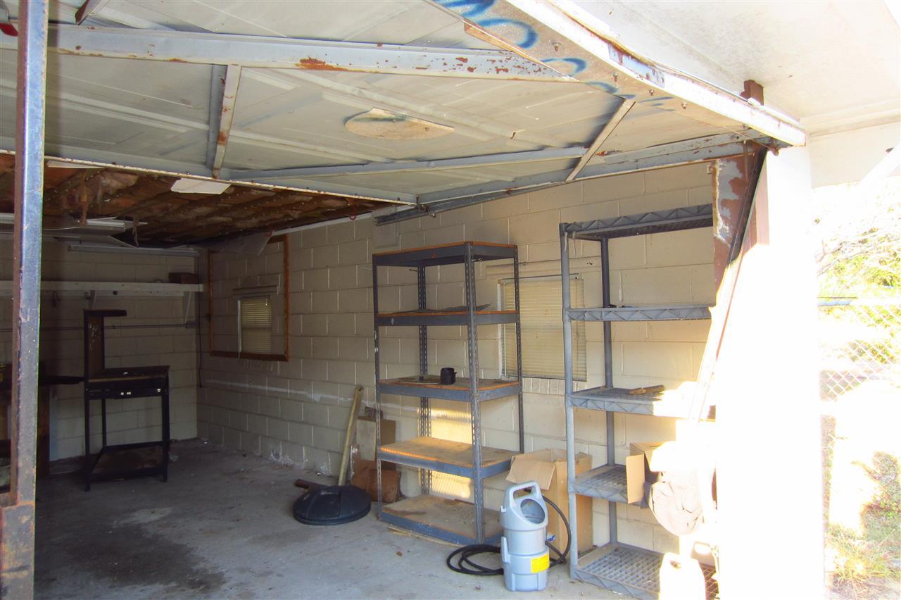 508 Pelham Road Pensacola, FL 32507 - Photo 19 of 22 Power, 4 windows, 2 shelving units convey