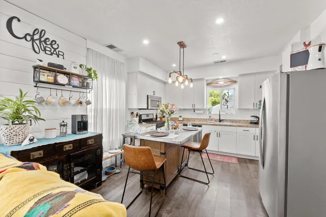 a view of a hallway with paintings on the wall