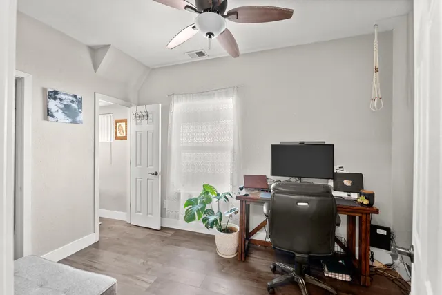 a white toilet sitting next to a bathroom sink