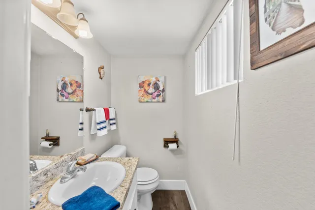 a bedroom with furniture and a fan