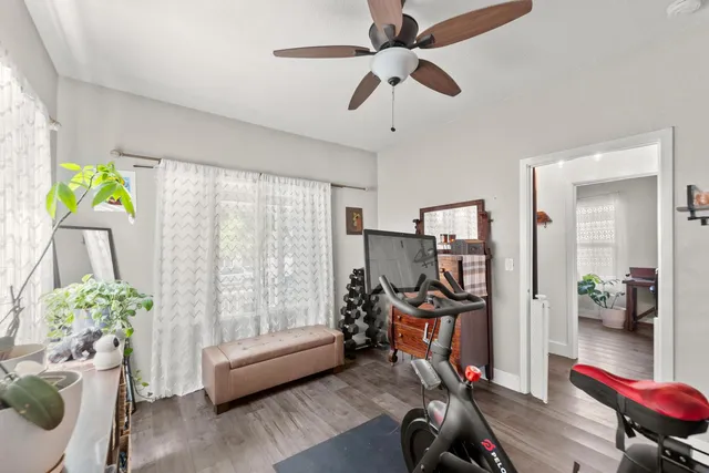 a backyard of a house with table and chairs