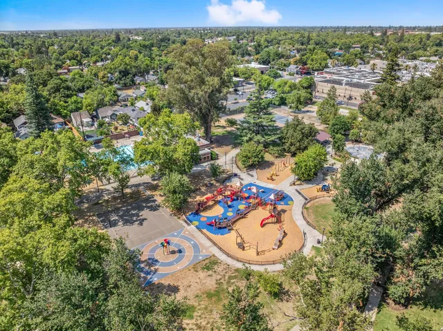 an aerial view of a house with a yard