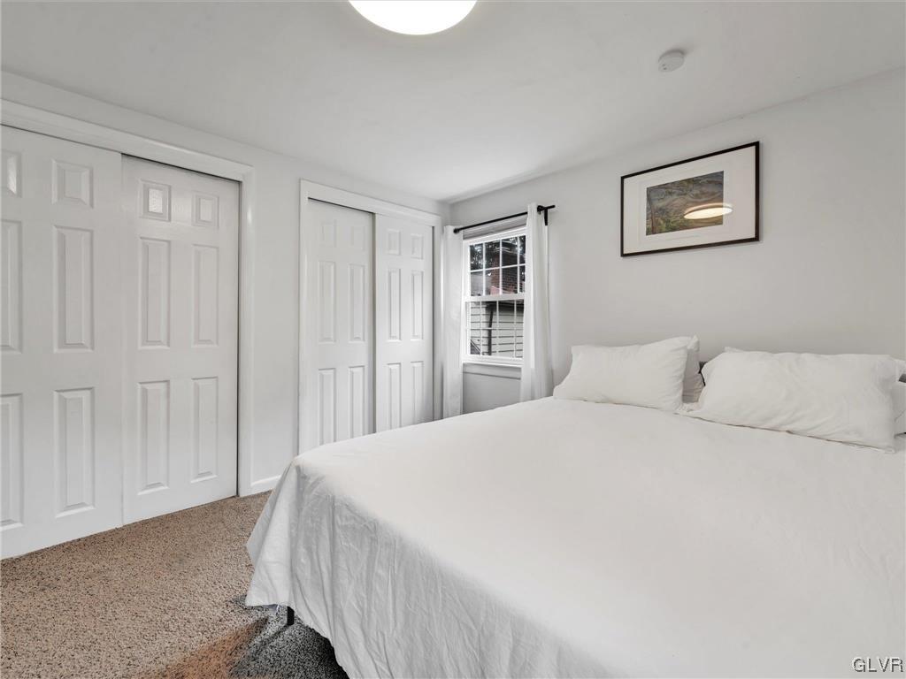 16 Hewett Road Cheltenham, PA 19095 - Photo 12 of 19 a spacious bedroom with a bed and a cabinets