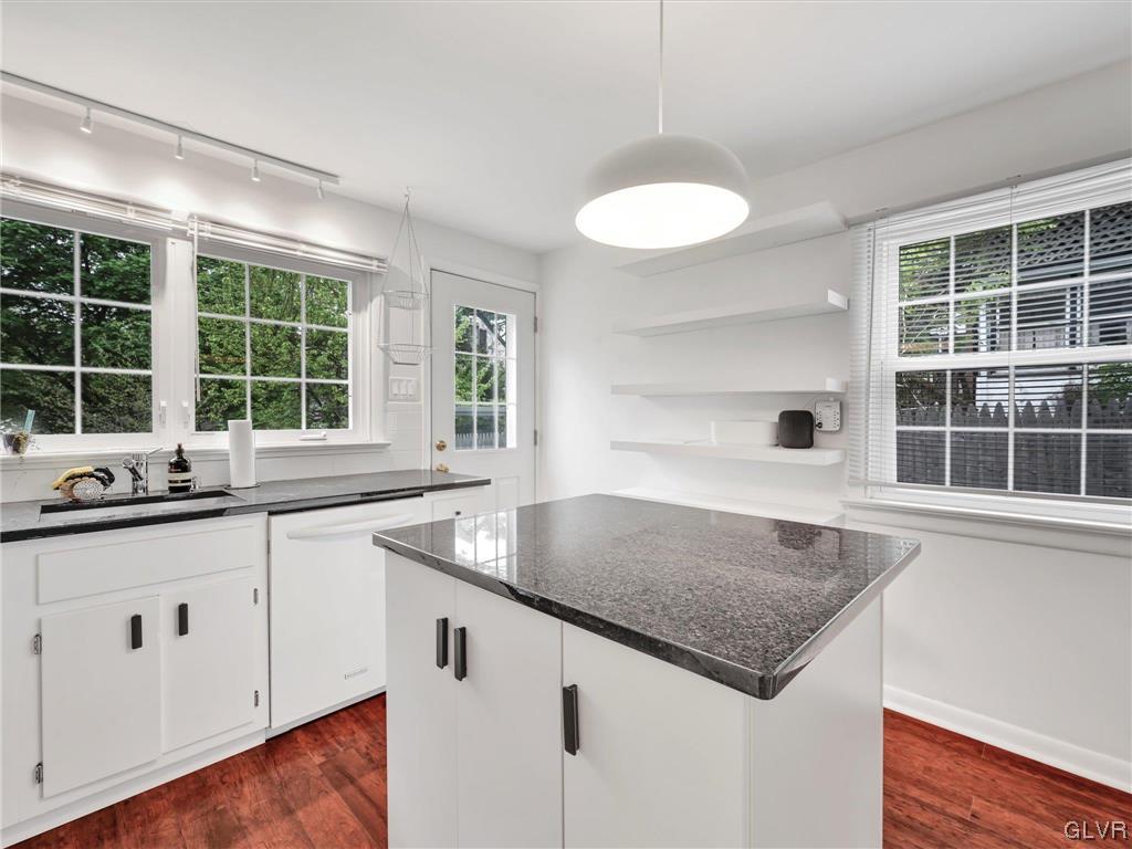 16 Hewett Road Cheltenham, PA 19095 - Photo 5 of 19 a kitchen with granite countertop a sink and a window