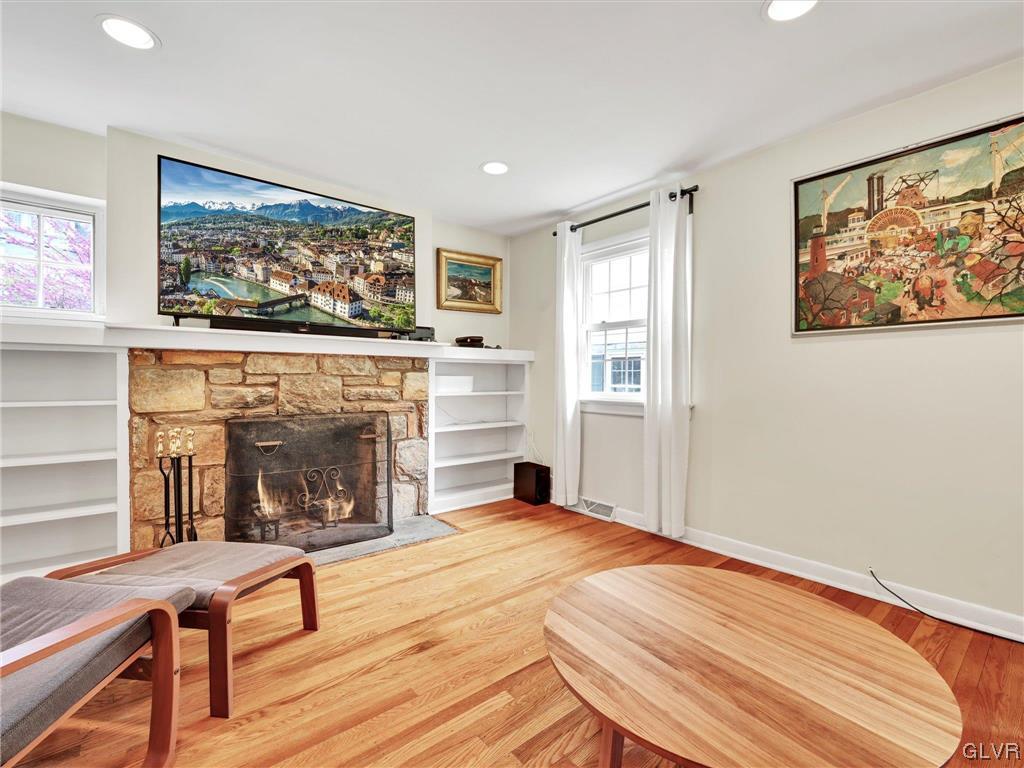 16 Hewett Road Cheltenham, PA 19095 - Photo 7 of 19 a living room with furniture a fireplace and paintings on wall