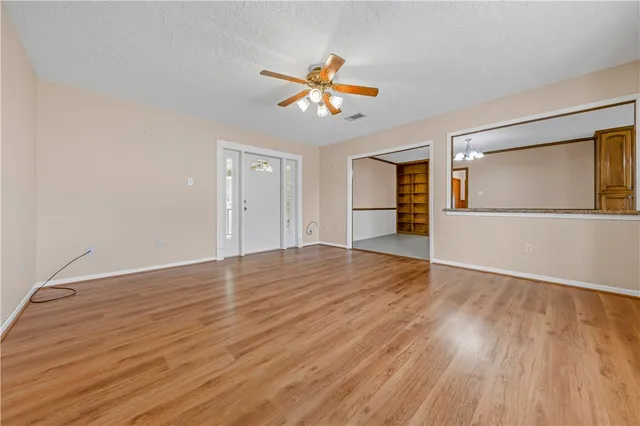 a bathroom with a sink vanity and toilet