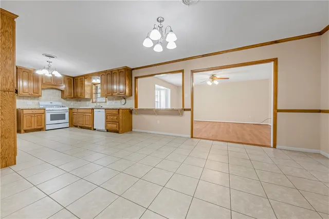 a view of a kitchen with a sink and cabinets