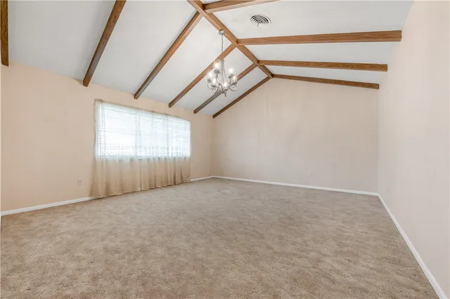 a view of an empty room with windows