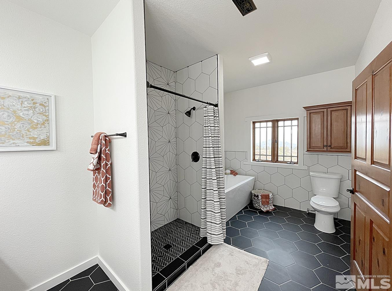 4280 Rocky Road Reno, NV 89521 - Photo 13 of 40 a bathroom with a toilet sink and shower
