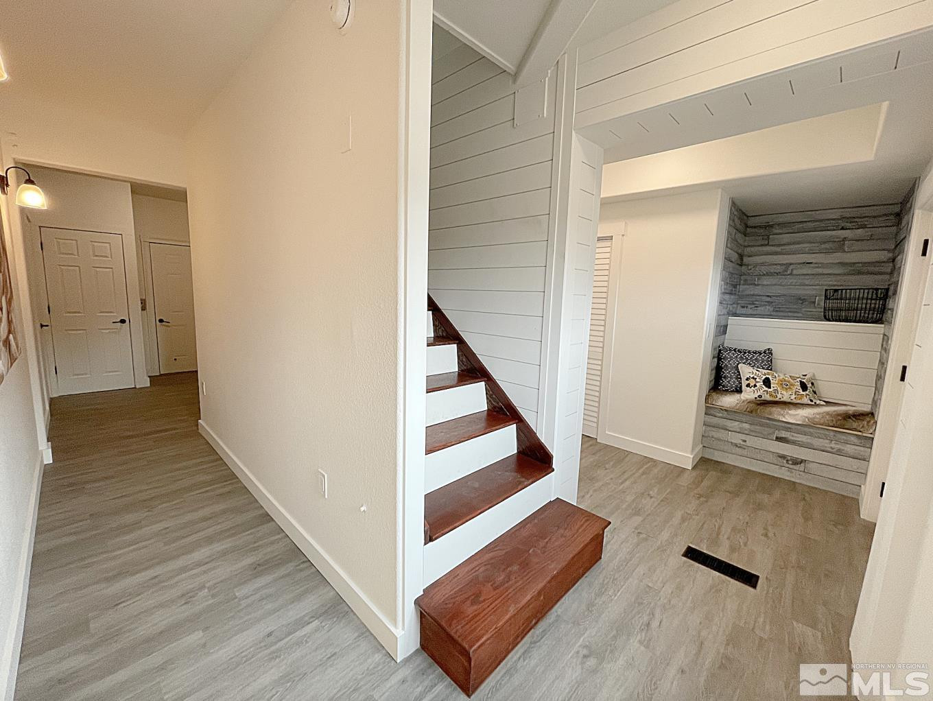 4280 Rocky Road Reno, NV 89521 - Photo 17 of 40 a view of a hallway with wooden floor and staircase