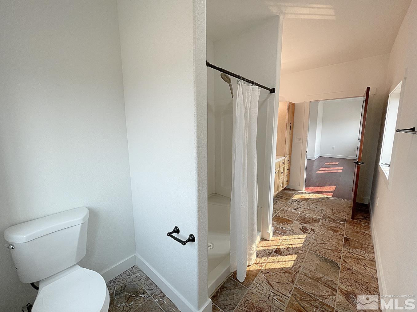 4280 Rocky Road Reno, NV 89521 - Photo 26 of 40 a bathroom with a toilet and a shower
