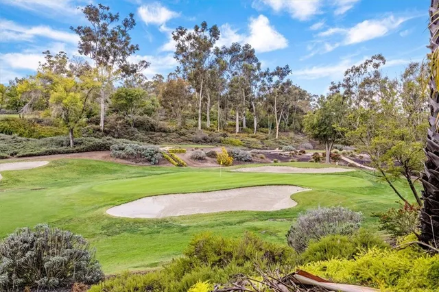 a view of a golf course with a garden