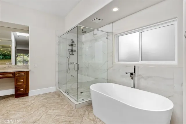 a large bathroom with a sink and a mirror