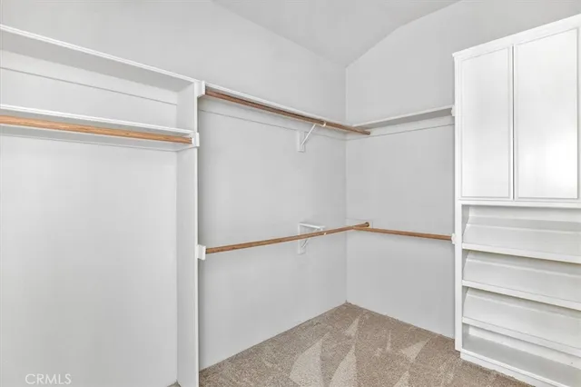 a view of a kitchen sink and cabinets
