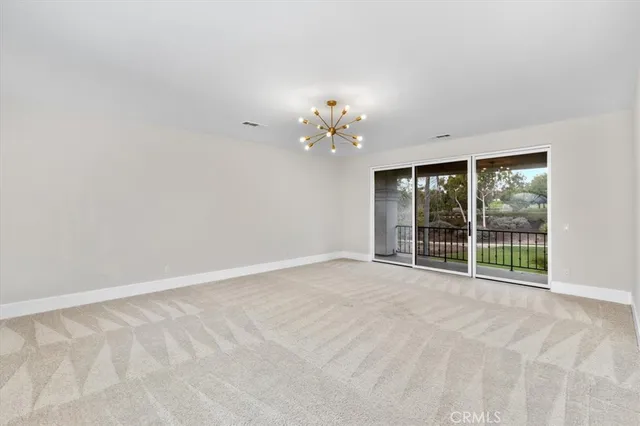 a view of an empty room with a balcony